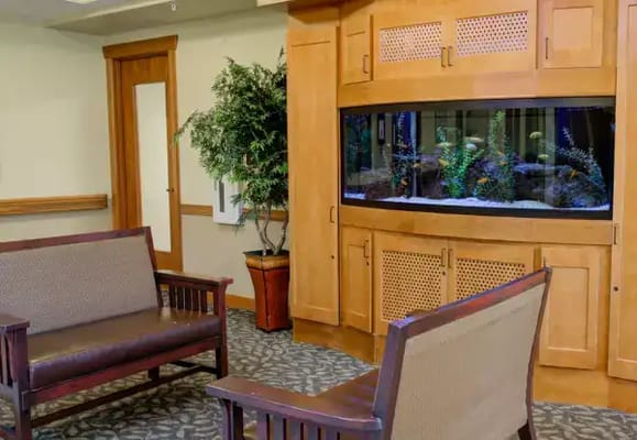 Interior lounge area with seating and aquarium