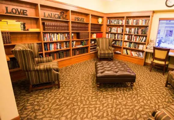 Cozy reading nook with bookshelves in a common area