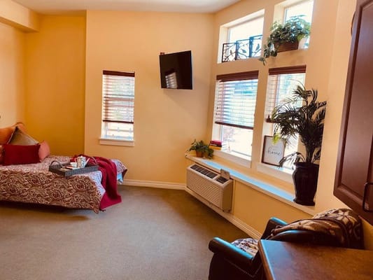 Cozy resident room with natural lighting and decor