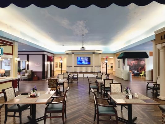 Bright dining area with tables and chairs