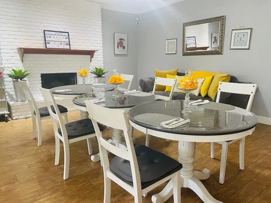 Dining area with tables and chairs in a cozy setting