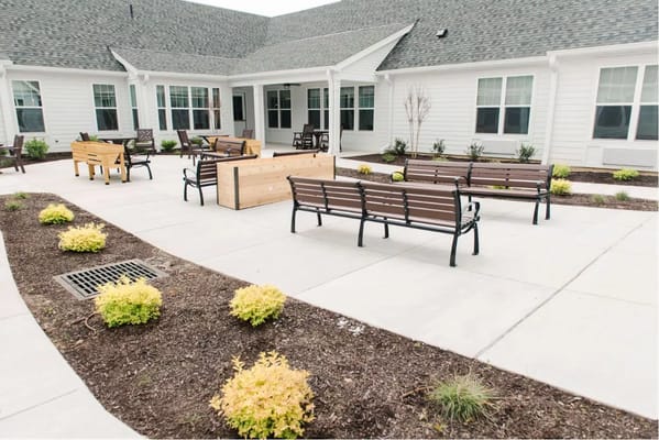 Outdoor patio area with benches and plants