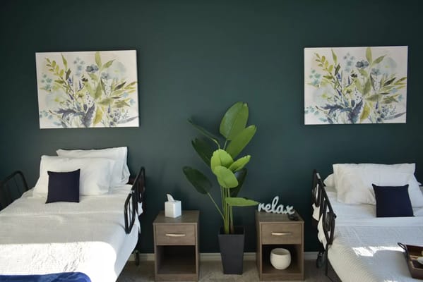 Cozy resident room with comfortable beds and decor