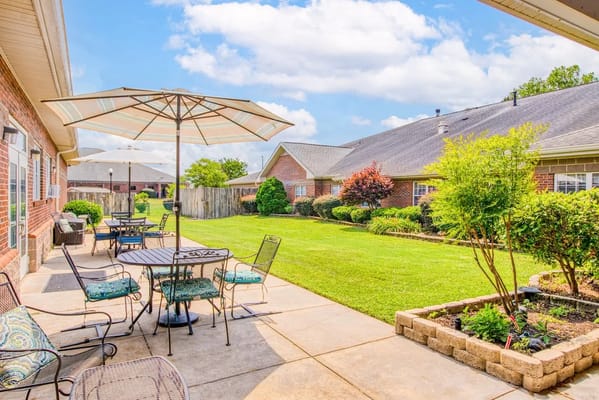 Outdoor patio area with seating and garden