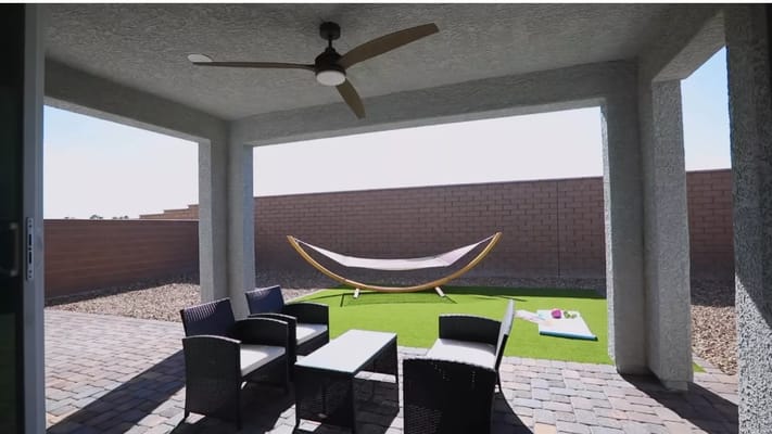 Outdoor seating area with hammock and patio furniture