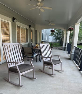 Rocking chairs on a serene porch area