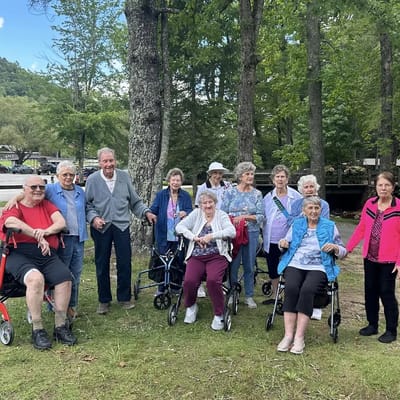 Residents enjoying a gathering outdoors in the park