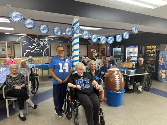 Residents and staff celebrating in a common area