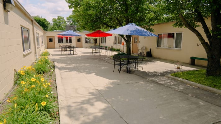 Outdoor courtyard with tables and umbrellas