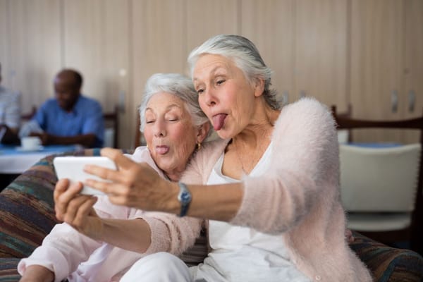 Two senior women taking a selfie together