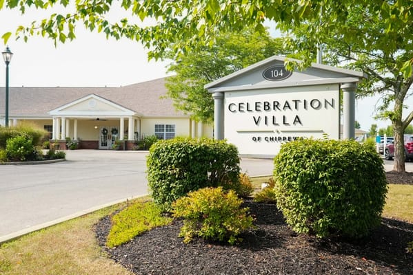 Exterior view of Celebration Villa building with landscaping