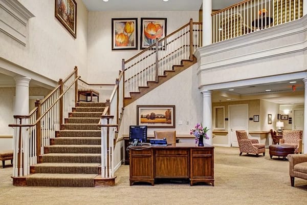 Interior view of a lobby with stairs and seating areas