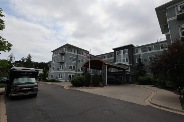 Facility exterior with entrance and vehicle
