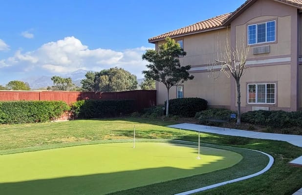 Exterior view of the facility's building and green space