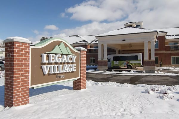 Exterior view of Legacy Village Provo with snowy landscape