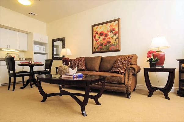 Cozy living room area with couch and dining setup