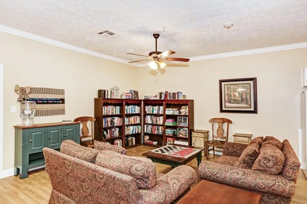 Cozy common area with bookshelves and seating