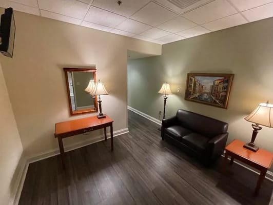 Cozy common area with seating and lamps