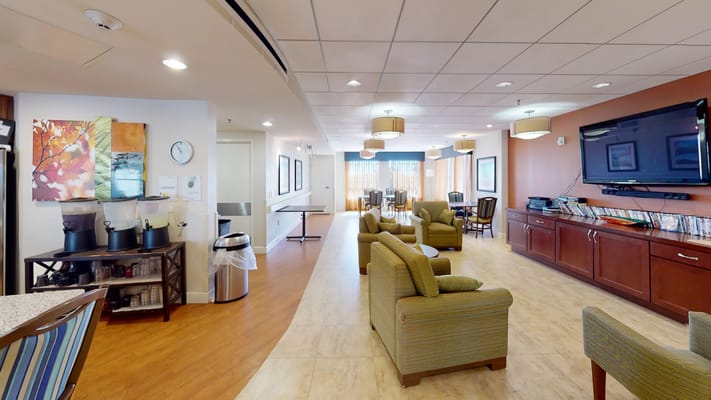 Common area with seating and bright lighting