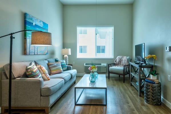 Bright interior of a resident living area with a couch
