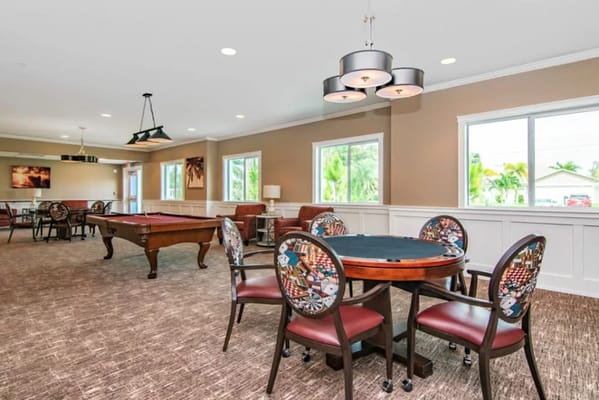Interior view of a common area with seating and pool table