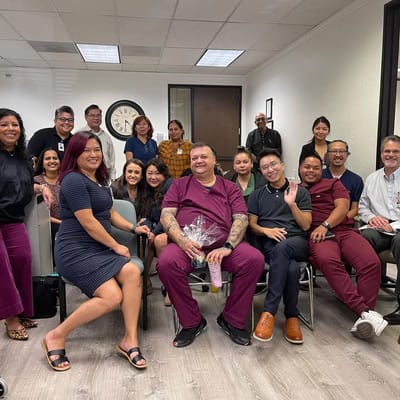 Staff and residents celebrating in a communal area