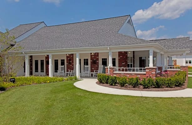 Exterior view of Medilodge of Monroe with grassy area