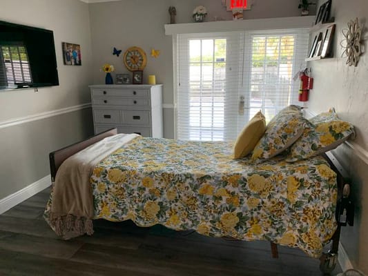 Bright interior of a resident's room with floral décor