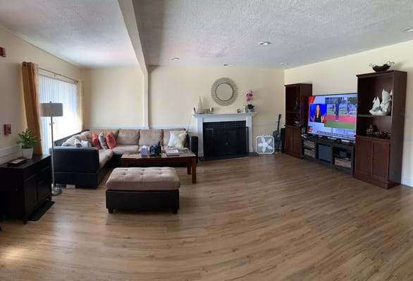 Spacious living room with seating and television