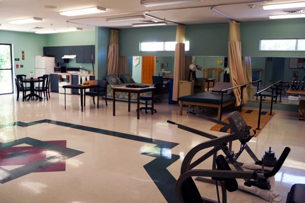Rehabilitation therapy room with exercise equipment