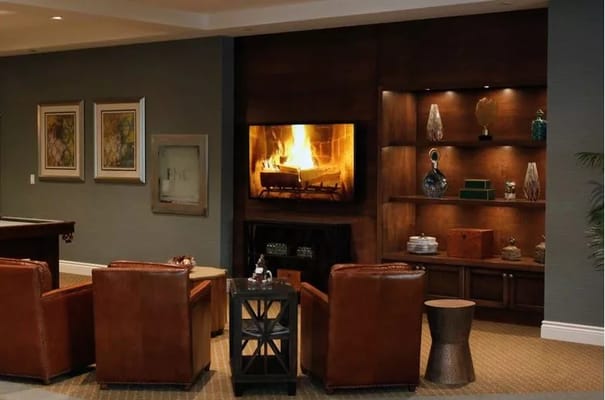 Common area with a cozy fireplace and seating