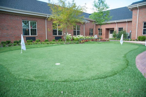 Well-maintained garden area with putting green
