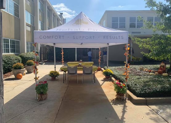 Outdoor seating area with fall decorations