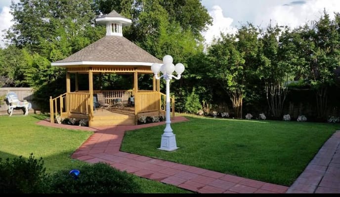 Elegant gazebo in a landscaped garden area
