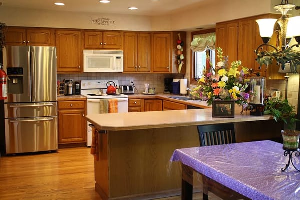 Bright kitchen area with a floral centerpiece