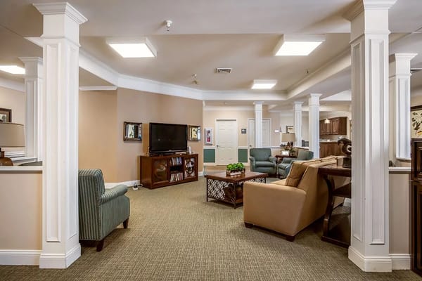 Spacious common area with seating and entertainment options