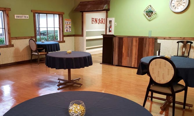 Interior dining area with tables set up for residents