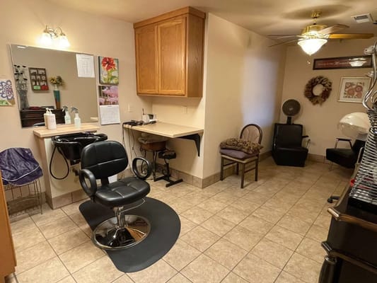 Interior of a hair salon with chairs and equipment