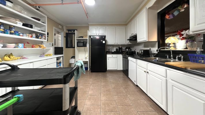 Kitchen area with cabinets and appliances visible