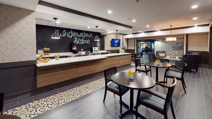 Dining area with modern bistro style and seating