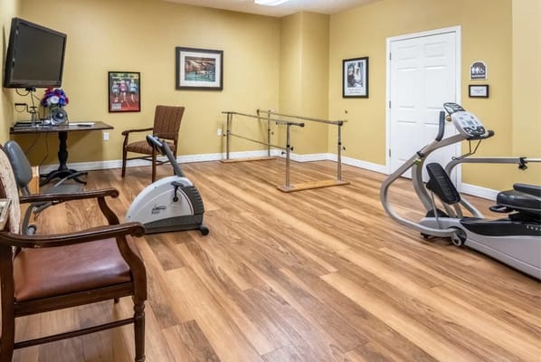 Inside view of a therapy gym with exercise equipment