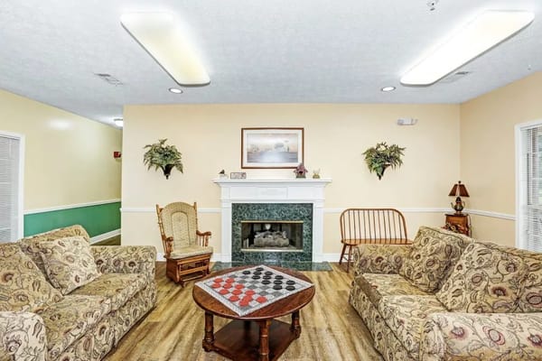 Cozy common area with seating and a fireplace