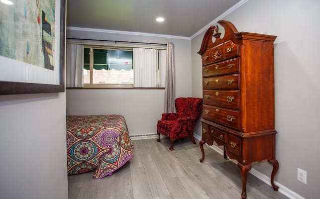 A cozy resident room with colorful decor