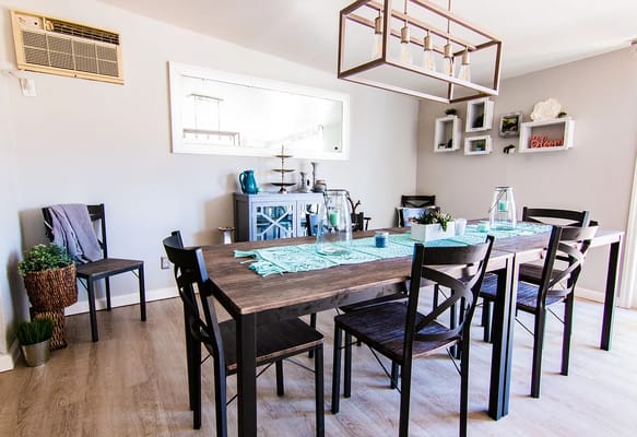 Bright dining area with a large table and chairs
