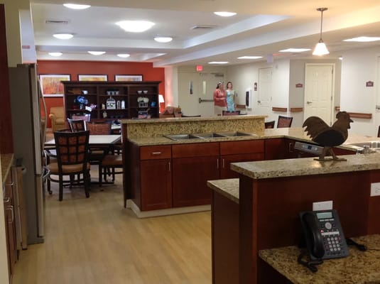 Spacious kitchen and dining area with wooden cabinets and seating