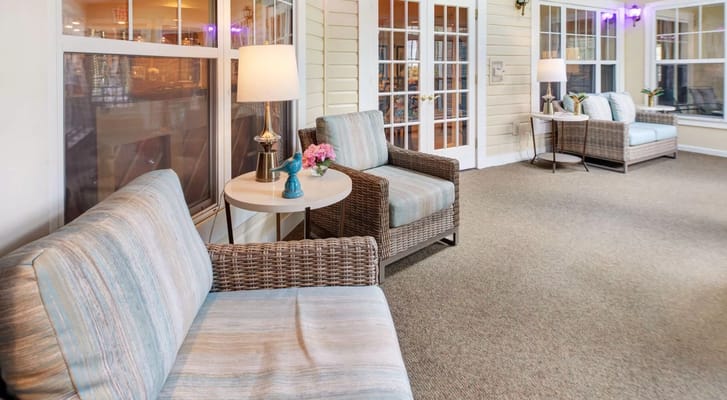 Lounge seating with a table and lamp in a bright room