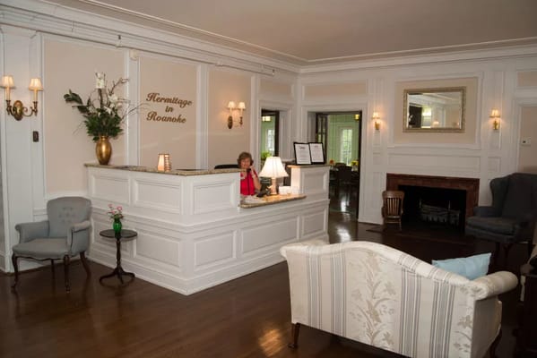 Reception area of Hermitage Roanoke with staff member