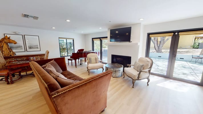 Cozy common area with seating and piano