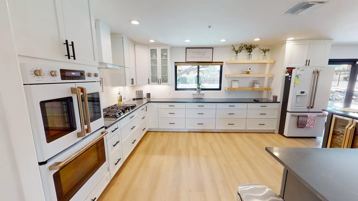 Modern kitchen interior with bright lighting and clean design