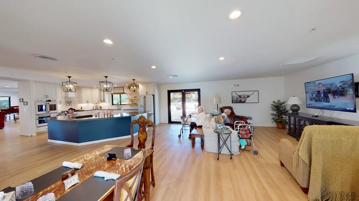Residents relaxing in a common area of the facility
